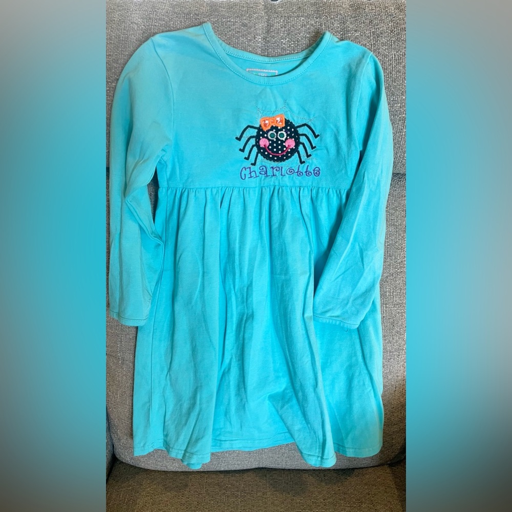 Long sleeve blue cotton dress with spider appliqué and Charlotte monogram